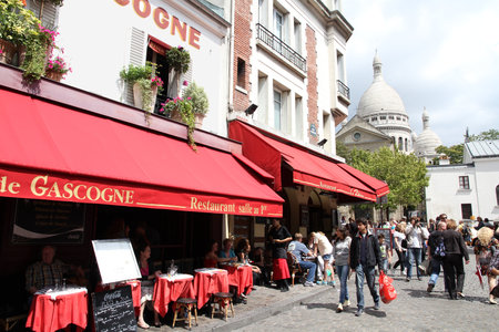 PARIS - JULY 22: Tourists visit Montmartre district on July 22, 2011 in Paris, France. Paris is the most visited city in the world with 15.6 million international arrivals in 2011.のeditorial素材