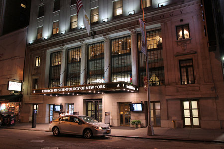NEW YORK - JULY 1: People walk past Church of Scientology on July 1, 2013 in New York. Scientology gained publicity through its involvement with celebrities like Tom Cruise and John Travolta.のeditorial素材