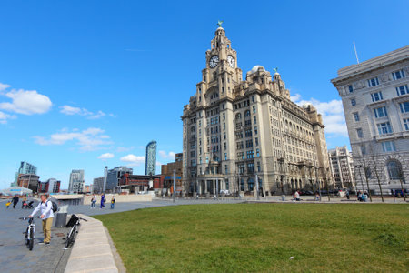 LIVERPOOL, UK - APRIL 20: People visit Pier Head area on April 20, 2013 in Liverpool, UK. Pier Head is part of Liverpool's famous UNESCO World Heritage Site.のeditorial素材