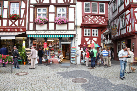 BERNKASTEL, GERMANY - JULY 19: Tourists stroll on July 19, 2011 in Bernkastel-Kues, Germany. According to its Tourism Office, the town is annually visited by 1.5m tourists. The region is famous for its wines.のeditorial素材