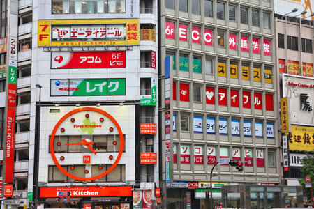 TOKYO - MAY 8: Colorful advertisements on May 8, 2012 in Shinjuku district, Tokyo. Shinjuku is one of the busiest districts of Tokyo, with many international corporate headquarters located here.のeditorial素材