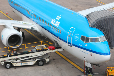 BIRMINGHAM, UK - APRIL 24: People board KLM Boeing 737 NG on April 24, 2013 at Birmingham Airport, UK. KLM employs more than 31 thousand people. It carried 25.8 million passengers in 2012.のeditorial素材