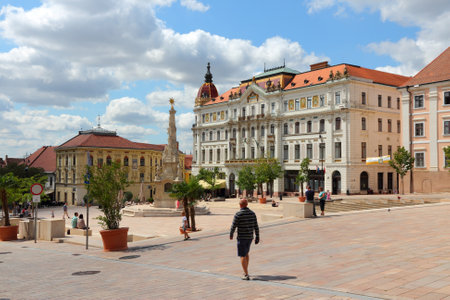 PECS, HUNGARY - AUGUST 12: People stroll on August 12, 2012 in Pecs, Hungary. Pecs is 5th largest city in Hungary. Tourism in Hungary is growing, with more than 20 million guest nights in 2011.のeditorial素材