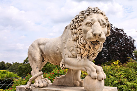 COMPIEGNE, FRANCE - JULY 26: Lion sculpture in gardens of Chateau Compiegne on July 26, 2011 in Compiegne, France. The royal residence was built for Louis XV. It was completed in 1788.のeditorial素材