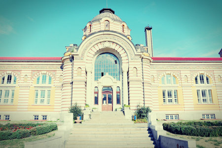 Sofia, Bulgaria - famous Central Mineral Baths building. Vienna Secession architecture style. Vintage color style with cross processing colors.のeditorial素材