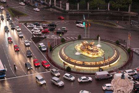 MADRID - OCTOBER 24: People drive downtown on October 24, 2012 in Madrid. Madrid is a popular tourism destinations with 3.9 million estimated annual visitors (official data).のeditorial素材