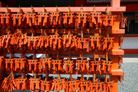 KYOTO, JAPAN - APRIL 18: Miniature torii gates at Fushimi Inari shrine on April 18, 2012 in Kyoto, Japan. Old Kyoto is a UNESCO World Heritage site and was visited by almost 1 million foreign tourists in 2010.のeditorial素材