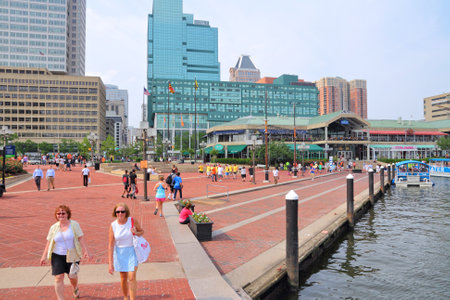 BALTIMORE, USA - JUNE 12, 2013: People visit Inner Harbor in Baltimore. Inner Harbor is a historic seaport and modern tourist attraction in Baltimore, the largest city in the state of Maryland.のeditorial素材