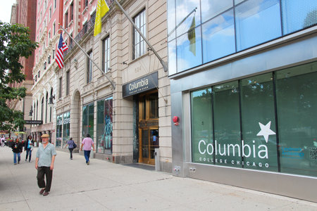 CHICAGO, USA - JUNE 27, 2013: People walk by Columbia College in Chicago. Columbia College was...