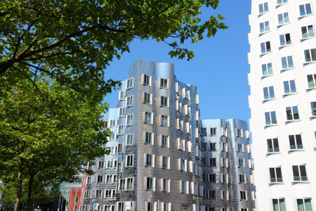 DUSSELDORF, GERMANY - JULY 8, 2013: Neuer Zollhof building in Dusseldorf, Germany. The building was designed by famous Frank Gehry and completed in 1998.のeditorial素材