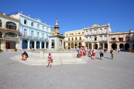 HAVANA, CUBA - FEBRUARY 27, 2011: People visit the Old Town Square (Plaza Vieja) in Havana, Cuba. Havana is the largest city in Cuba and its Old Town is a UNESCO World Heritage Site.のeditorial素材