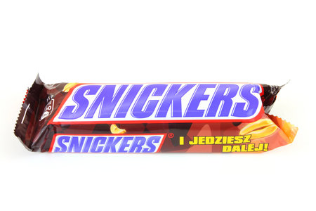 WARSAW, POLAND - MAY 20, 2010: Twix candy bar against a white background. It is manufactured by Mars Corporation, the 3rd largest privately held company in the United States (as of 2012).のeditorial素材