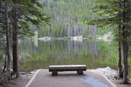 Rocky Mountain National Park in Colorado, USA. Bear Lake - bench with scenic view.の写真素材