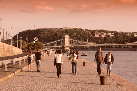 BUDAPEST, HUNGARY - JUNE 22, 2014: People visit Danube embankment late afternoon in Budapest. 3.3 million people live in Budapest Metropolitan Area. It is the largest city in Hungary and 9th largest in the EU.のeditorial素材