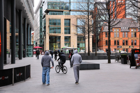MANCHESTER, UK - APRIL 22, 2013: People visit shopping area in Manchester, UK. Greater Manchester is...