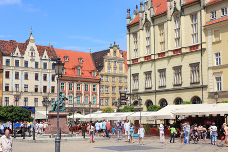 WROCLAW, POLAND - JULY 6, 2014: People visit Rynek (Market Square) in Wroclaw. Wroclaw is the 4th largest city in Poland with 632,067 people (2013).のeditorial素材