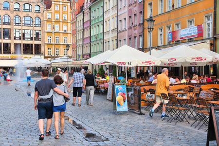 WROCLAW, POLAND - JULY 6, 2014: People visit Rynek (Market Square) in Wroclaw. Wroclaw is the 4th largest city in Poland with 632,067 people (2013).のeditorial素材