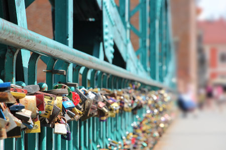 WROCLAW, POLAND - JULY 6, 2014: Love locks on Tumski bridge in Wroclaw. Love padlock tradition is a threat to structural integrity of many bridges around the world.のeditorial素材