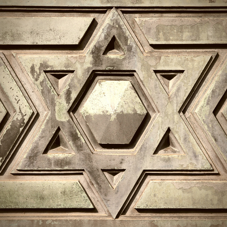Star of David - Jewish symbol on an old Hebrew grave in Milan, Italy. Square composition.の写真素材