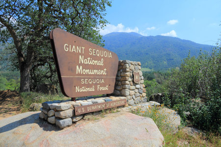 SPRINGVILLE, UNITED STATES - APRIL 12, 2014: Entrance sign to Giant Sequoia National Monument in California. National Monument was created in 2000 and covers area of 1330 km2.のeditorial素材
