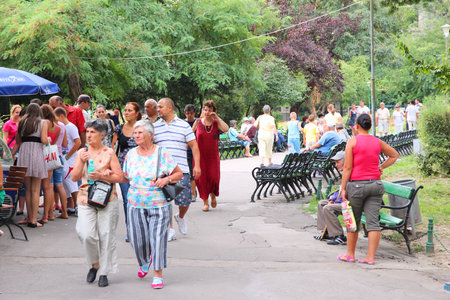 BUCHAREST, ROMANIA - AUGUST 19, 2012: People visit famous Cismigiu Gardens in Bucharest, Romania. In 2009 Bucharest was the 21st most visited city worldwide (by international arrivals).のeditorial素材