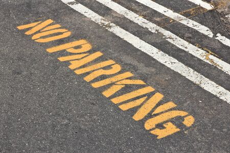 No parking sign stencil painted onto street pavement.の写真素材