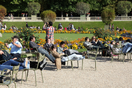 PARIS, FRANCE - JULY 23, 2011: Tourists visit Luxembourg Gardens in Paris, France. Paris is the most visited city in the world with 15.6 million international arrivals in 2011.のeditorial素材