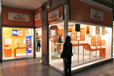 BERGAMO, ITALY - OCTOBER 20, 2012: People visit Wind mobile phone store in Bergamo. Wind has 24 percent market share in Italy mobile phone market (with 22.4 million subscribers in 2013).のeditorial素材