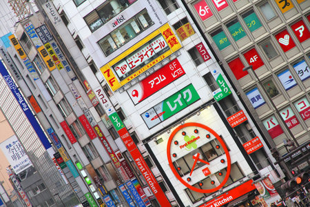 TOKYO, JAPAN - MAY 8, 2012: Colorful advertisements in Shinjuku district, Tokyo. Shinjuku is one of the busiest districts of Tokyo, with many international corporate headquarters located here.のeditorial素材