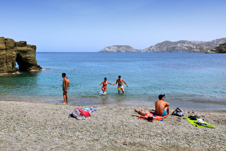 AGIA PELAGIA, GREECE - MAY 21, 2013: People visit beach in Agia Pelagia, Crete, Greece. Crete attracts 2.8 million annual tourists (2011).のeditorial素材