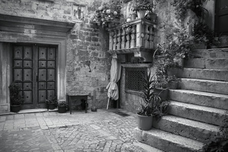 Croatia - Trogir in Dalmatia (UNESCO World Heritage Site). Old town detail. Black and white tone - retro monochrome color style.のeditorial素材
