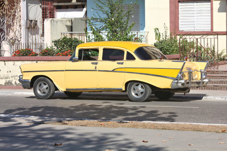 SANCTI SPIRITUS, CUBA - FEBRUARY 6, 2011: Oldtimer American car parked in the street in Sancti...