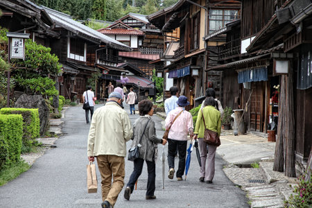 TSUMAGO, JAPAN - MAY 2, 2012: People visit old town of Tsumago. Tsumago-juku was a historic post...
