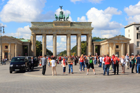 BERLIN, GERMANY - AUGUST 27, 2014: People visit Brandenburg Gate in Berlin. Berlin is Germany's largest city with population of 3.5 million.のeditorial素材