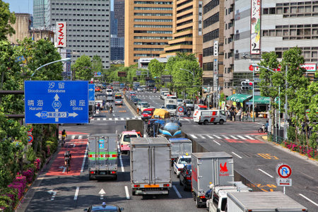 TOKYO, JAPAN - MAY 11, 2012: People drive cars in Tokyo. With 591 vehicles per capita, Japan is a country with one of highest car ownership rates.のeditorial素材