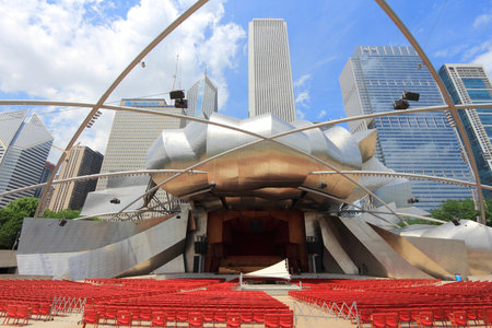 CHICAGO, USA - JUNE 27, 2013: People visit Jay Pritzker Pavilion in Millennium Park in Chicago. Jay Pritzker Pavilion is a famous bandshell designed by Frank Gehry.のeditorial素材