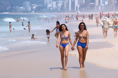 RIO DE JANEIRO, BRAZIL - OCTOBER 19, 2014: People visit Ipanema beach in Rio de Janeiro. In 2013 1.6 million international tourists visited Rio.のeditorial素材