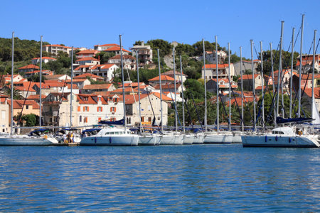 TROGIR, CROATIA - JUNE 25, 2011: People visit marina in Trogir, Croatia. Trogir, as a UNESCO World Heritage Site, is one of most visited places in Croatia.のeditorial素材