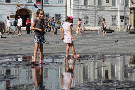 SIBIU, ROMANIA - AUGUST 24, 2012: People visit main square in Sibiu, Romania. Sibiu's tourism is growing with 284,513 museum visitors in 2001 and 879,486 visitors in 2009.のeditorial素材