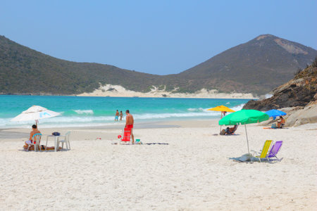 CABO FRIO, BRAZIL - OCTOBER 17, 2014: People visit Cabo Frio Prainhas beach in state of Rio de Janeiro in Brazil. Brazil had 5.17 million visitors in 2012.のeditorial素材