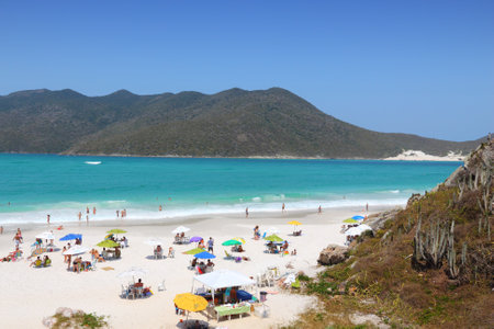 CABO FRIO, BRAZIL - OCTOBER 17, 2014: People visit Cabo Frio Prainhas beach in state of Rio de Janeiro in Brazil. Brazil had 5.17 million visitors in 2012.のeditorial素材