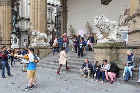 FLORENCE, ITALY - APRIL 30, 2015: People visit famous public sculpture display in Loggia dei Lanzi, Florence, Italy. Italy is visited by 47.7 million tourists a year (2013).のeditorial素材
