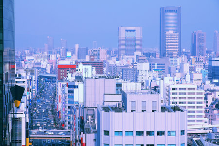 Osaka, Japan - skyline of modern city in the region Kansai. Cross processing color tone - filtered retro style.のeditorial素材