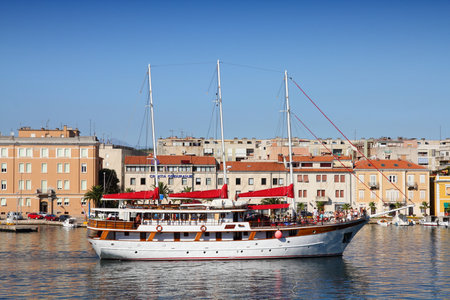 ZADAR, CROATIA - JUNE 22, 2011: Tourists enjoy sailing ship trip in Zadar, Croatia. Zadar, the 5th largest city in Croatia, is a major seaside destination.のeditorial素材