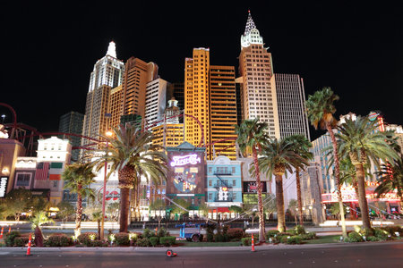 LAS VEGAS, USA - APRIL 13, 2014: People visit the famous Strip in Las Vegas. 15 of 25 largest hotels in the world are located at the strip with more than 60 thousand rooms.のeditorial素材