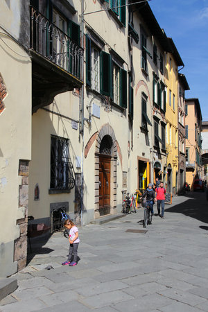 FLORENCE, ITALY - APRIL 29, 2015: People visit Old Town street in Lucca, Italy. Italy is visited by 47.7 million tourists a year (2013).のeditorial素材