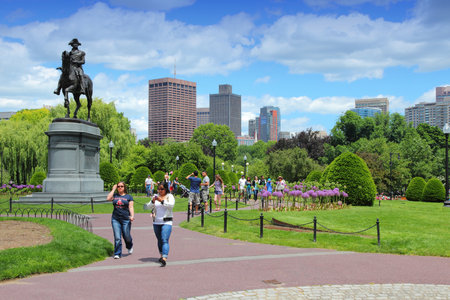 BOSTON, USA - JUNE 9, 2013: People visit Washington Monument at Public Garden in Boston. Public Garden dates back to 1837 and is a registered monument.のeditorial素材