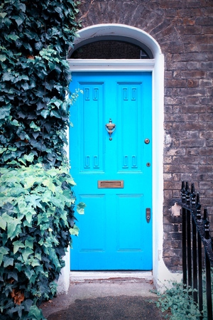 London, United Kingdom - typical colorful Victorian architecture door. Retro filtered color style.の写真素材