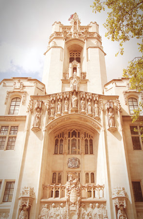 London, United Kingdom - Middlesex Guildhall, home of the Supreme Court of the United Kingdom. Retro filtered color style.のeditorial素材