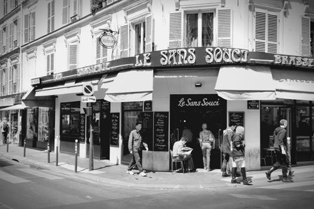PARIS, FRANCE - JULY 22, 2011: People visit Le Sans Souci cafe in Paris, France. Le Sans Souci cafe is a typical establishment for Paris, one of largest metropolitan areas in Europe.のeditorial素材